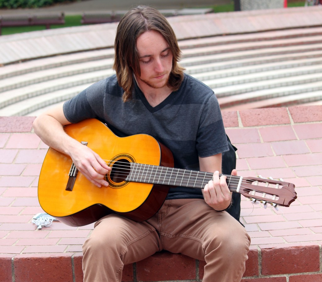 City College student Kevin Werre, biology major, playing a guitar in the Quad before heading to his next class. Julie Jorgensen, Photo Editor. | juliejorgensenexpress@gmail.com