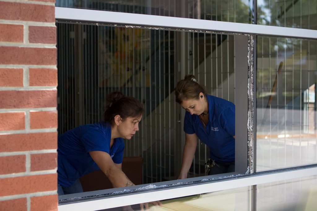 City College custodians Amy Wright and Josephine Ciddio hurry to clean up broken glass after a break-in Aug. 29 at the Student Services building some time between Sunday night and early Monday morning. Photo by Vanessa S. Nelson vanessanelsonexpress@gmail.com