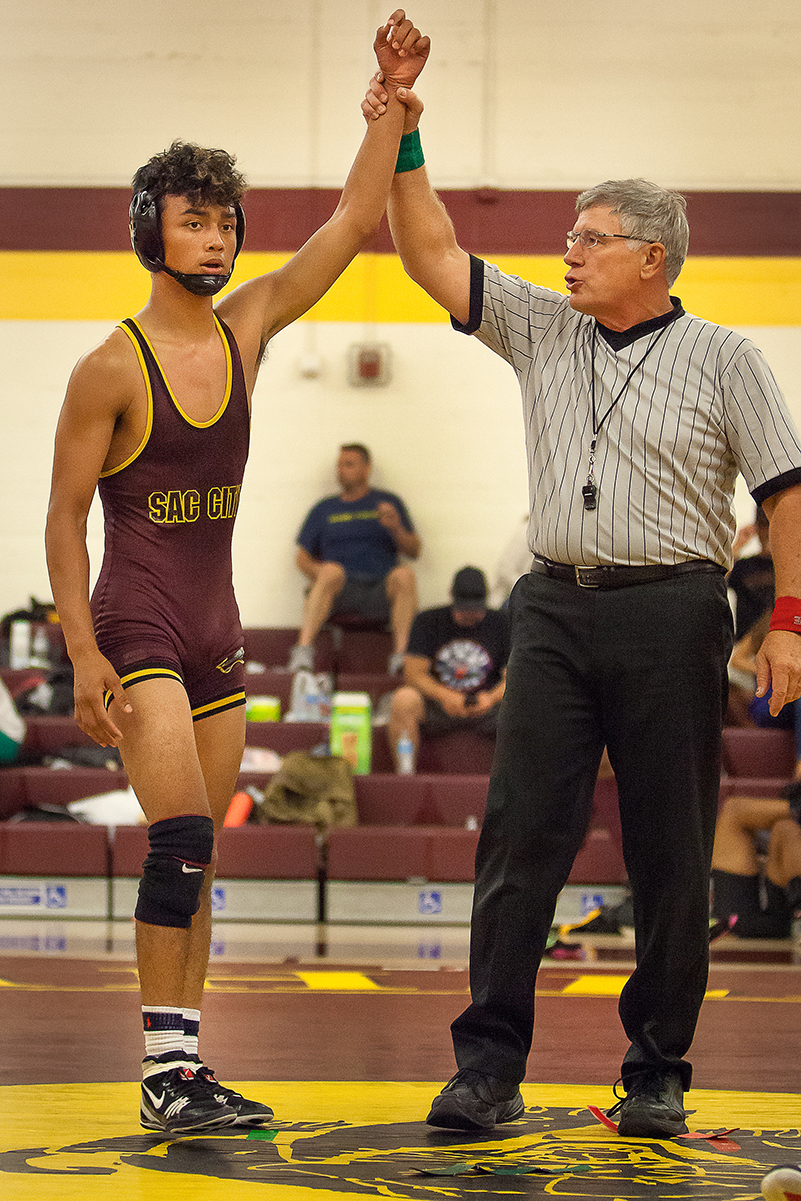 Devon Silva, City College freshman wins his first match at the KLS Air Express Invitational at the North Gym on Sept. 17th. Devon goes on to be co-champion in his wieght class of 133 with his teammate sophomore Ray Angeles. Dianne Rose/dianne.rose.express@gmail.com