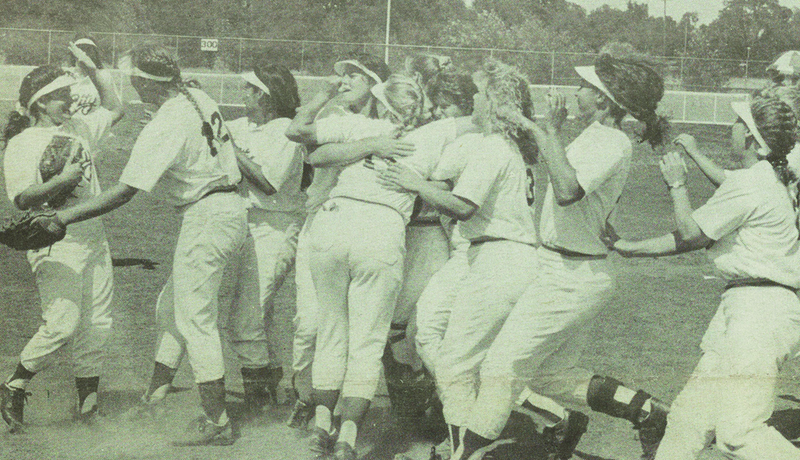 CELEBRATION!—The Panthers' softball team members congratulate each other after defeating Palomar in the state championship playoffs May 17. Exchanging hugs, from left to right, are Deanna Novoa, Stefanie Acton, Miko Kubabara, Amy Windmiller, Becky Burroughs, Beth Gerken, Kim Wright, Trish Geduilas, Christa Sanchez and Laura Merritt.  Photo by Rich Bickel 