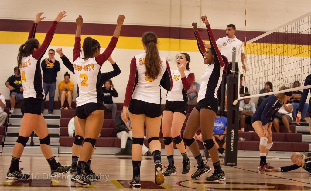 City College volleyball team reacts after winning a point in the match against American River College at the North Gym on Sept. 21st.  ©2016 Dianne Rose
