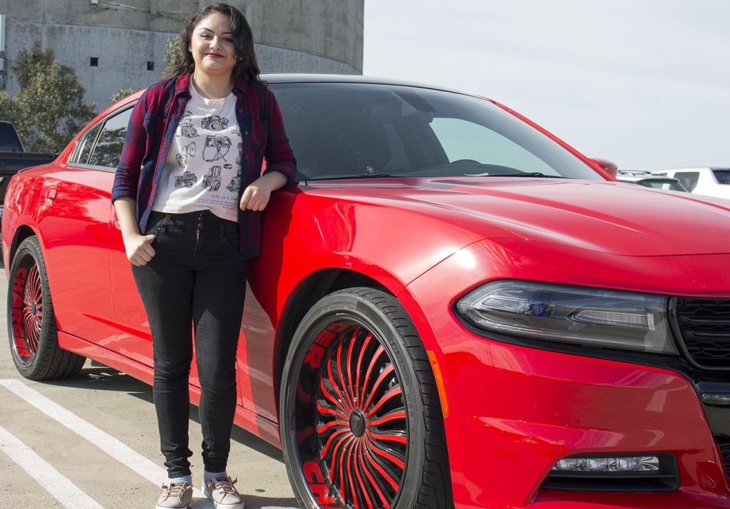 City College student Jessica Perez, photography major, standing next to a Dodge Charger Rallye in the City College parking structure. Nov. 7, 2016. Julie Jorgensen, Staff Photographer. juliejorgensenexpress@gmail.com
