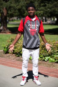 John Huntley, 19, says sports is his passion and his fashion decisions are greatly influenced by it. He pairs his new shoes with his favorite Chicago Bulls jersey. Ulysses Ruiz | Staff Photographer | Uruiz.express@gmail.com