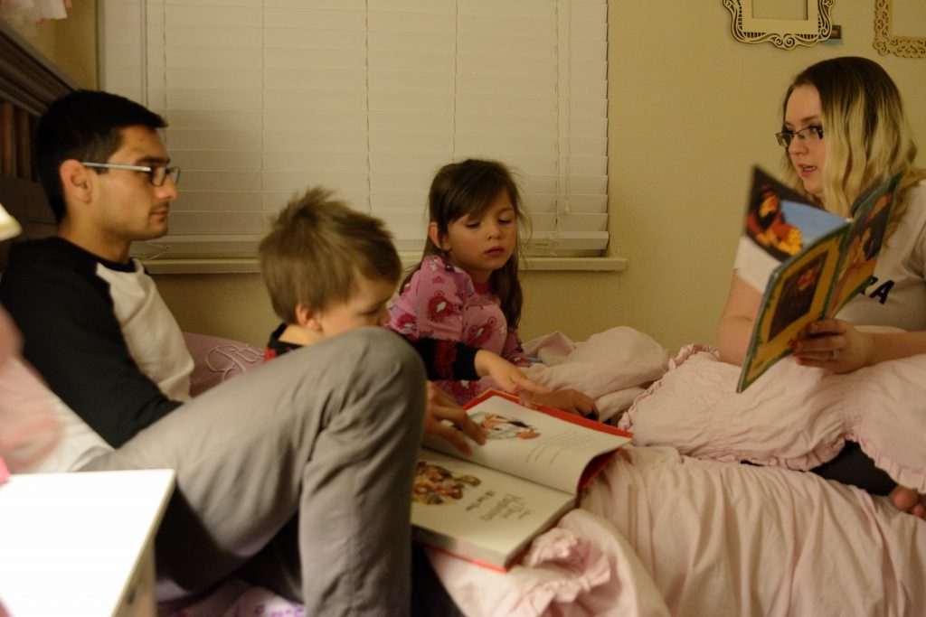 Mark, Troy (2), Natalie (6) and Emily Wirth enjoy bedtime stories as part their evening routine. Mark and Emily recently returned to school full time at Sacramento City College to pursue a degree in Nursing. Sacramento, CA Wednesday, February, 1, 2017. Jason Pierce | Staff Photographer | jpierce.express@gmail.com