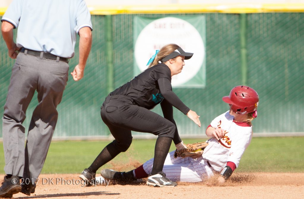 Taylor Fratto, City College sophomore infielder is tagged out after trying to steal second on a bad throw to first during the game against Folsom College at the Yard on March 21st © 2017 Dianne Rose