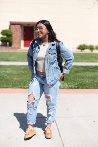 Lexy Nguyen, 19, studies fashion at City College. Nguyen is sporting denim on denim and trendy, reflective sunglasses. Nguyen says Vanessa Hudgens is her style muse and loves Coachella festival inspired outfits. Ulysses Ruiz | Staff Photographer | Uruiz.express@gmail.com