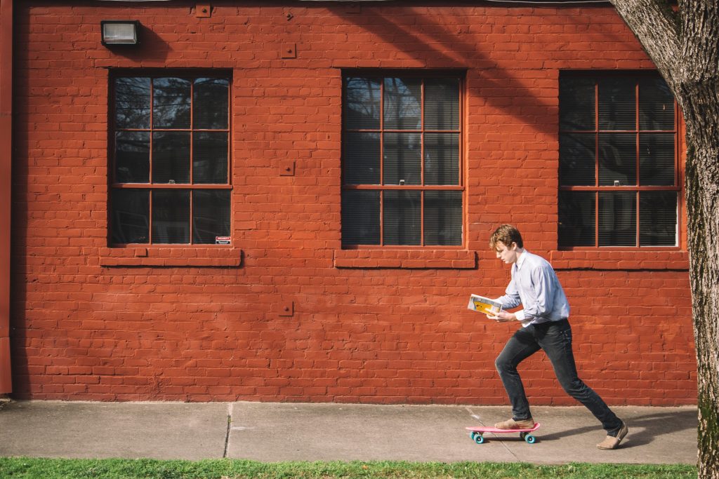 In between creating art and creative projects Ryan Morris sneaks away on his penny board.
Photo by: Julia Maya