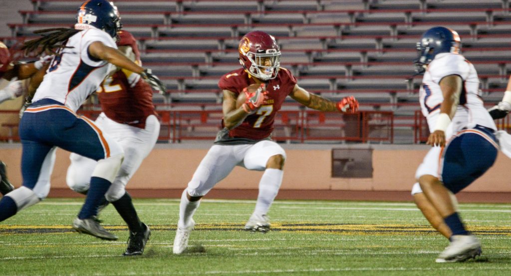 City College wide receiver Jordan Moore (#7) runs the ball Saturday evening early in the 2nd quarter of the game against College of the Sequoias at Hughes Stadium.  Jason Pierce | Photo Editor | jpierce.express@gmail.com
