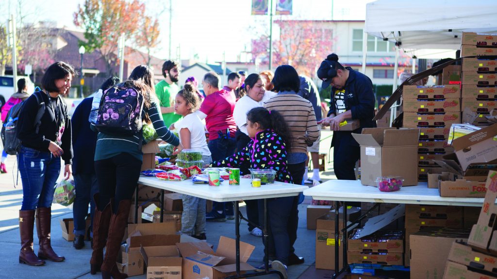 The+RISE+food+distribution+near+the+College+Store+operates+at+full+tilt+Nov.+29.+Some+of+the+nonperishable+food+items+handed+out+came+from+Phi+Theta+Kappas+food+drive.+Photo+by+Vanessa+S.+Nelson+%7C+vanessanelson.express%40gmail.com