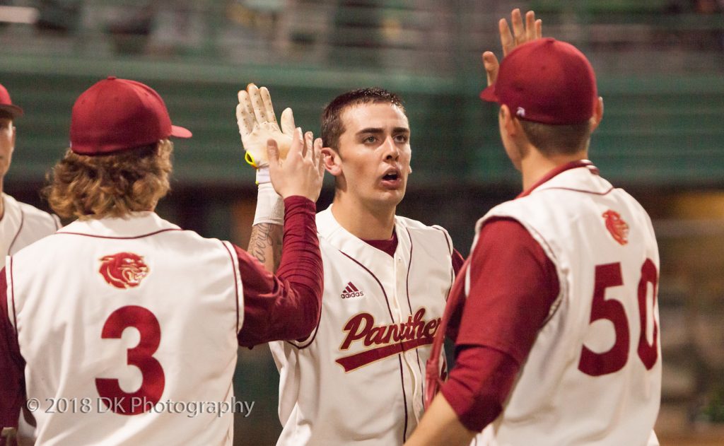 City College third baseman Brodie Garner high fives his team after scoring a run Jan. 26 at Union Stadium. The Panthers defeated Cabrillo College Feb. 20 in a 2-0 shutout. | Photo by Dianne Rose | dianne.rose.express@gmail.com