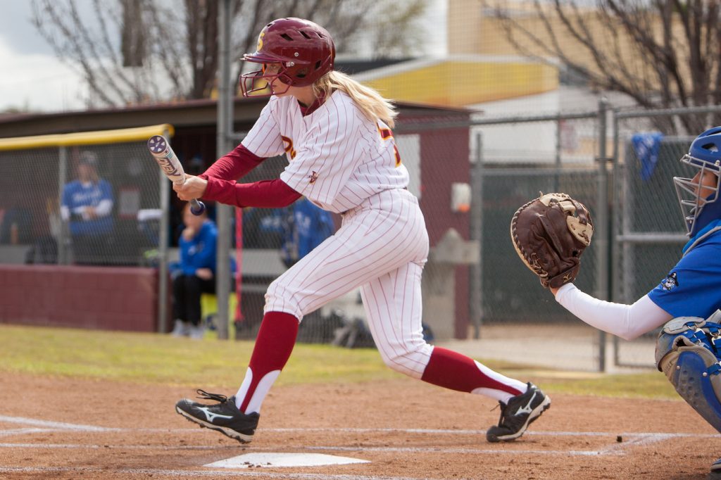 City College sophomore Sydney Craft bunts her way on base March 24 against Modesto Junior College at The Yard. Craft collected three hits in the doubleheader against the Pirates. | Photo by Dianne Rose |