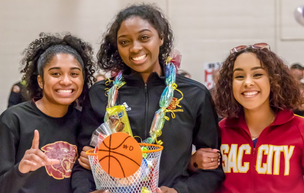 City Snapshot! Sophomore Night. Women's basketball celebrates the contributions of sophomore Kayla Farr (center) with teammate, Nanai Maui and City Cheerleader, Alyssa McAlister, before City's last home game against San Joaquin Delta College.   Photo by Sara Nevis | Staff Photographer | snevis.exress@gmail.com