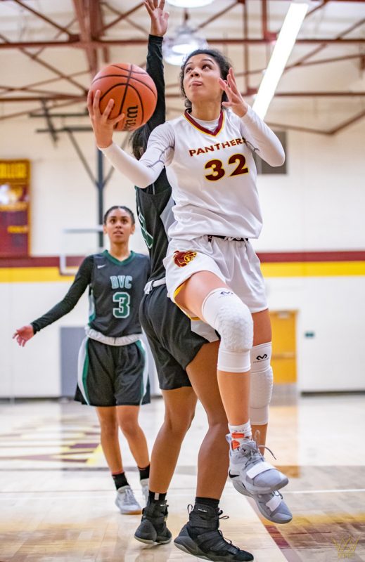 Maddison Coleman glides past defenders in their 88-82 loss against Diablo Valley College.  Photo by Ryan Middleton | Photo Editor | rmiddleton.express@gmail.com