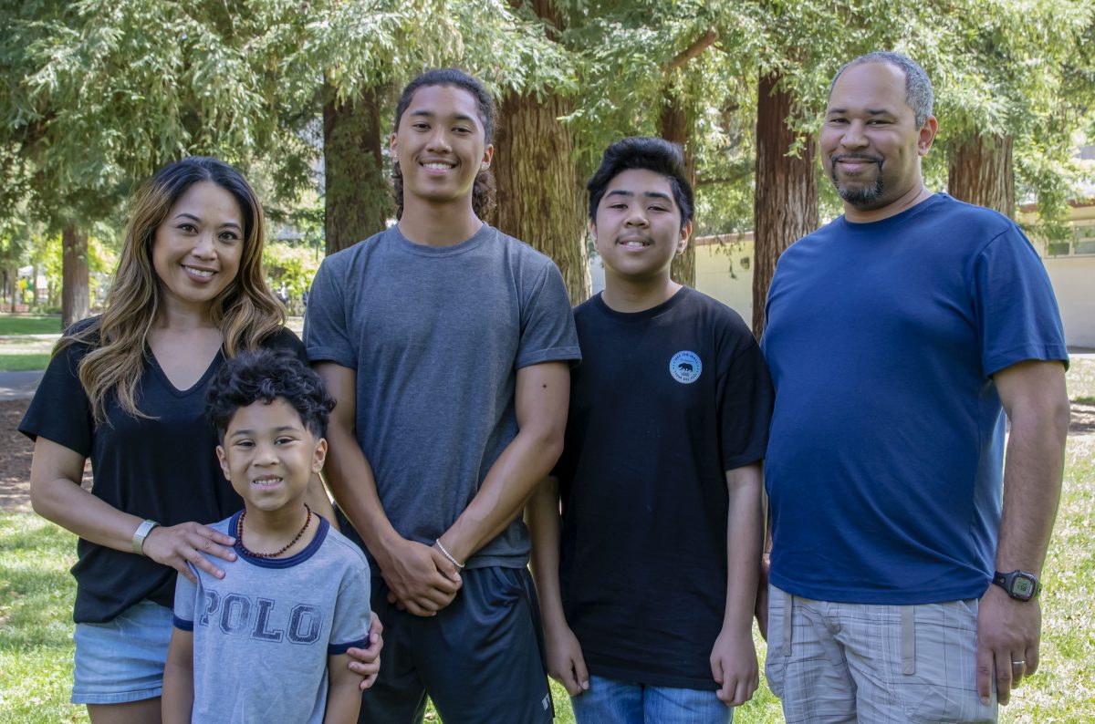 (left to right) Marissa Johnson, business office associate and communication studies major and her 6-year-old Jonah, 16-year-old Josiah, 11-year-old Nathaniel Jr., and husband Nathaniel Sr.  Johnson family at Sacramento State. Photo by Sara Nevis | Staff Photographer | snevis.express@gmail.com