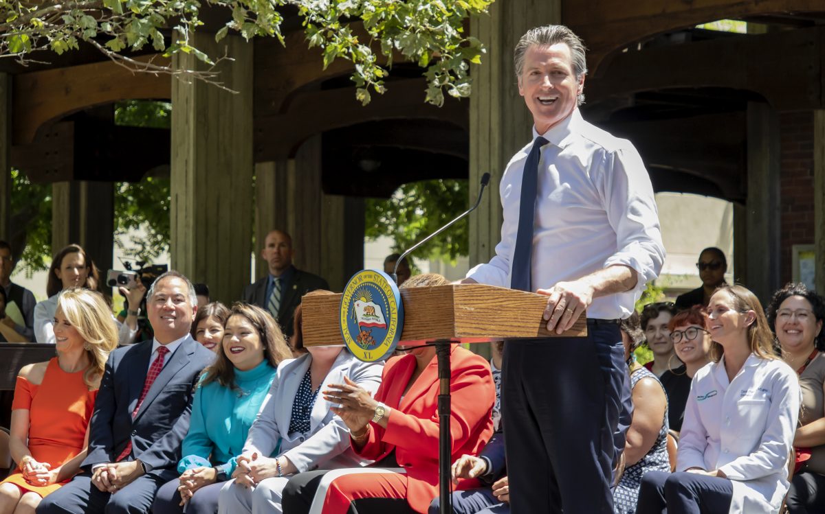 Governor Gavin Newsom signs bills SB 76, SB 77, and SB 93 and then speaks to assorted body of students and community about the Affordability Budget in the quad at City College on Monday, July 1, 2019. Photo by Sara Nevis | Photo Editor | snevis.express@gmail.com