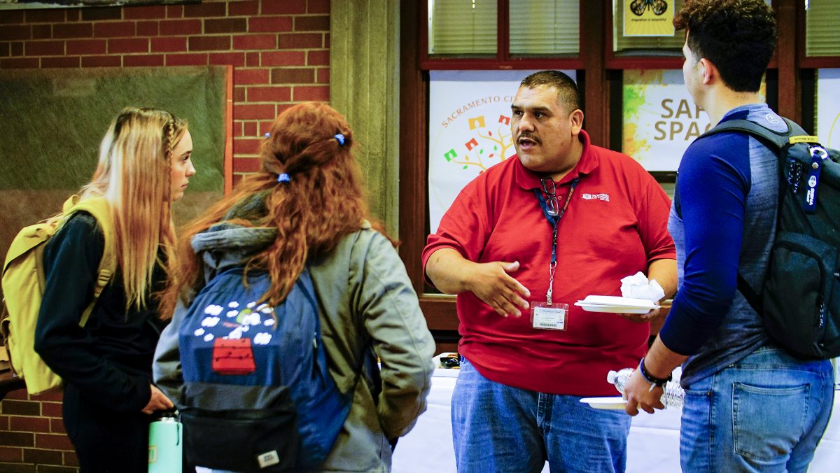 Sol Waldorf-Sifuentes, Senior IT talks to students during the Career Education Day at the Student Center at City College Tuesday, Oct. 1, 2019. (Photo by Jerome Jeffries/jerome1027@msn.com)