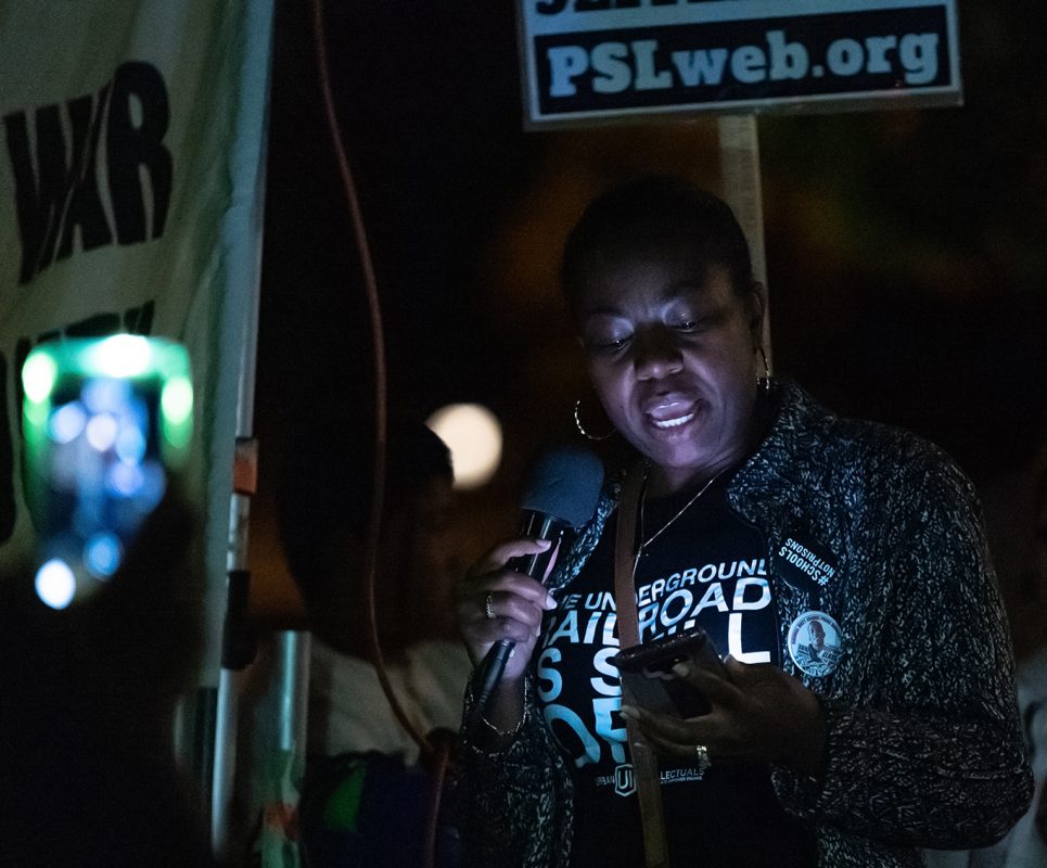 Lit by cell phone screens and cameras, Sonia Lewis delivers a speech to fellow demonstrators | 21st Street and 1st Avenue | Sacramento, California  | Tuesday 10-22-2019 | (Niko Panagopoulos/npanagopoulos.express@gmail.com)