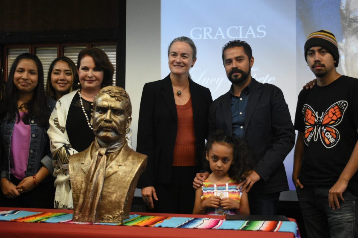 (left to right) Lucy Topete (in white), sculptor of the bust of Mexican revolutionary Emiliano Zapata; Ilse Lilián Ferrer Silva, Consul General of Mexico in Sacramento; and Edgar Zapata, director of the Pro-Veterans of the Revolution of the South Institute and great-grandson of Emiliano Zapata, surrounded by City College students after the unveiling of Emiliano Zapatas bust in the Student Center at City College Friday, Sept. 27, 2019. (Photo by Daniel Perez/danielperez2077@gmail.com)