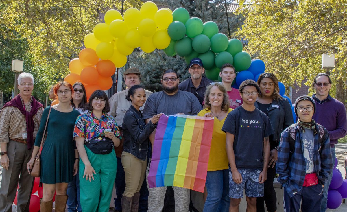 Group photo with Sacramento LGBT Community Center volunteers, City College faculty and students after the National Coming Out Day held in the Student Center at City College Thursday, Oct. 10, 2019. (Sara Nevis/snevis.express@gmail.com)