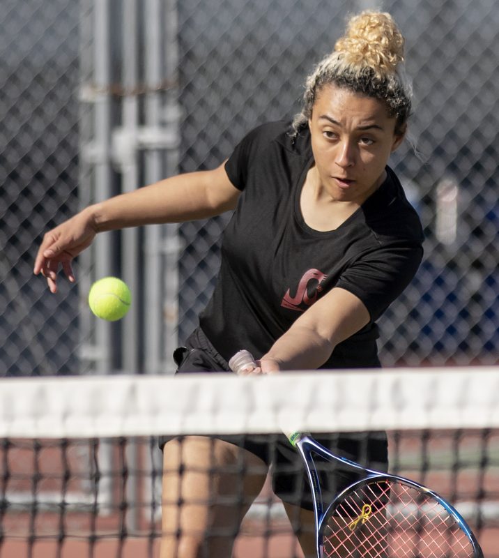 City College Xiomara Harris, No. 2, returns the ball during doubles in the match against Porterville College at the tennis courts at City College Friday, Feb. 14, 2020. Porterville defeated City College 9-0. (Sara Nevis/snevis.express@gmail.com)