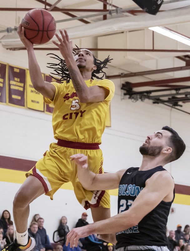City College’s Quiezhee Q Gantt (5) makes the layup past Folsom Lake College’s Jeremy Dexter (23) during the second half in the game in the North Gym Friday, Feb. 21, 2020. Gantt has 12 points in the game. City College defeated Folsom Lake 88-82. (Sara Nevis/snevis.express@gmail.com)