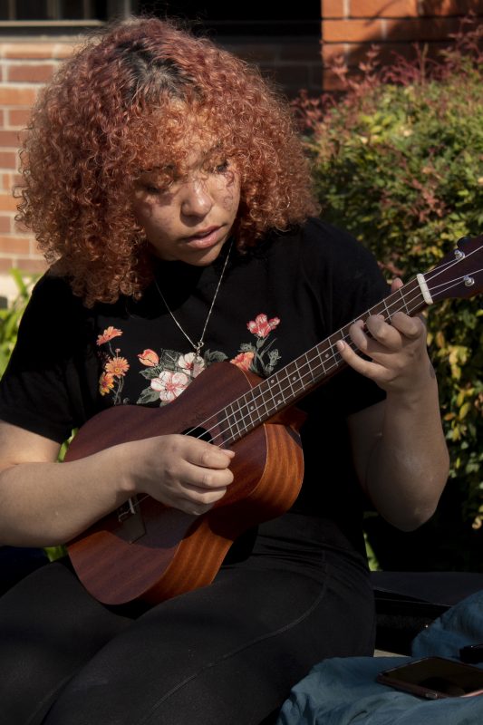 Feliceya Torres, allied health and nursing major, plays the ukulele in the quad, before the school closed due to COVID-19, Wednesday, March 11, 2020. (Kelsey Brown/kwbrown.express@gmail.com)