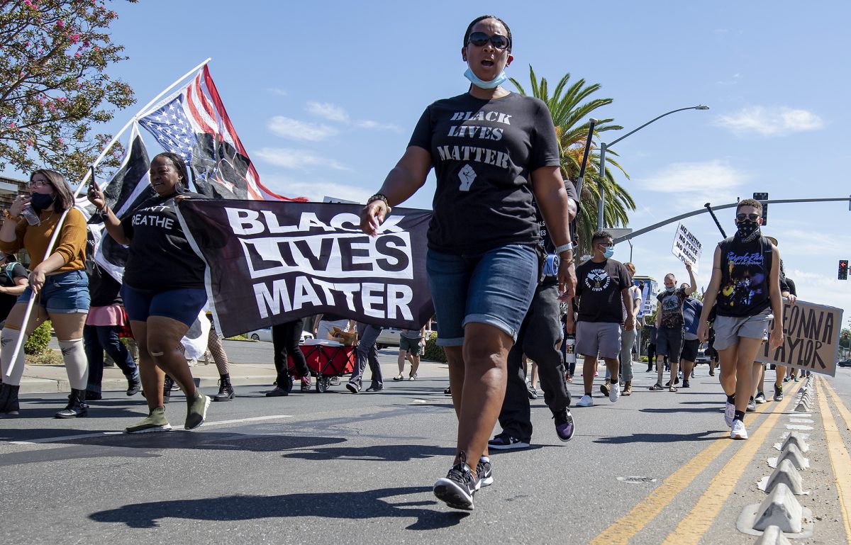 Leia Schenk, center, founder of Empact Org, marches down West Lodi Avenue during the Justice for Breonna Taylor March organized by Progressive Unity at Emerson Park in Lodi, California, Saturday, Aug. 15, 2020. (Sara Nevis/saranevisphoto@gmail.com)