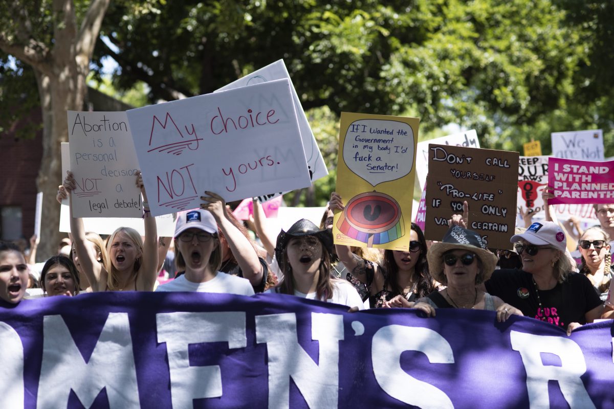 Protestors march from the State Capitol through downtown Sacramento as part of the Bans Off Our Bodies rally in support of abortion rights on Saturday, May 14, 2022. Photo Credit: Abby Similien / asimilien.express@gmail.com