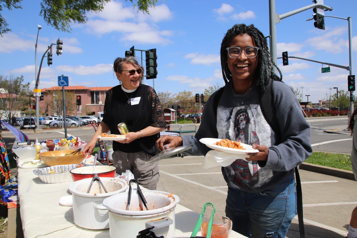 Reverend Portia Hopkin (left), is pictured with Africa Smart, a first-year business management major (right), who was on her way to her tutoring session on April 12 when she heard about the free lunch being offered to City College students located on Sutter Road. Smart said “she hadnt had time to eat breakfast because she is a mom who works full time and barely made it to class, so the free meal was helpful.” Photo credit: Ellie Appleby / eappleby.express@gmail.com
