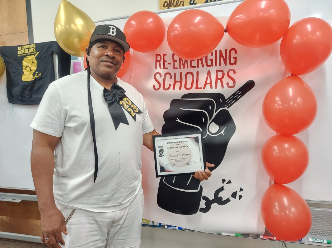 
Daniel H. Bean Jr. proudly displays his certificate of completion and advancement at the celebration ceremony held on Tuesday, May 23, 2023 at City College for students that finished the Re-Emerging Scholars program. Photo credit: Ellie Appleby / eappleby.express@gmail.com
