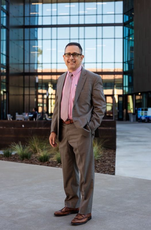 City College President Albert Garcia stands in front of the newly named Natural Sciences Building (NAS) Wednesday, Oct. 18, 2023. Photo credit: Nick Shockey / nshockey.express@gmail.com