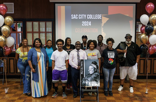 City College’s Black graduates gather for a photo during the second-annual celebration of Black graduates event held in the Student Center Building Thursday, May 2, 2024.