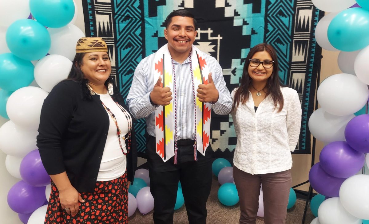 City College student Juan Delarosa, gives the thumbs-up between Vanessa Esquivido-Hernandez, (left) and Ayacaxtli Galvis-Torrez during the Los Rios Native American Celebration held on May 10 2024, at Folsom Lake College.