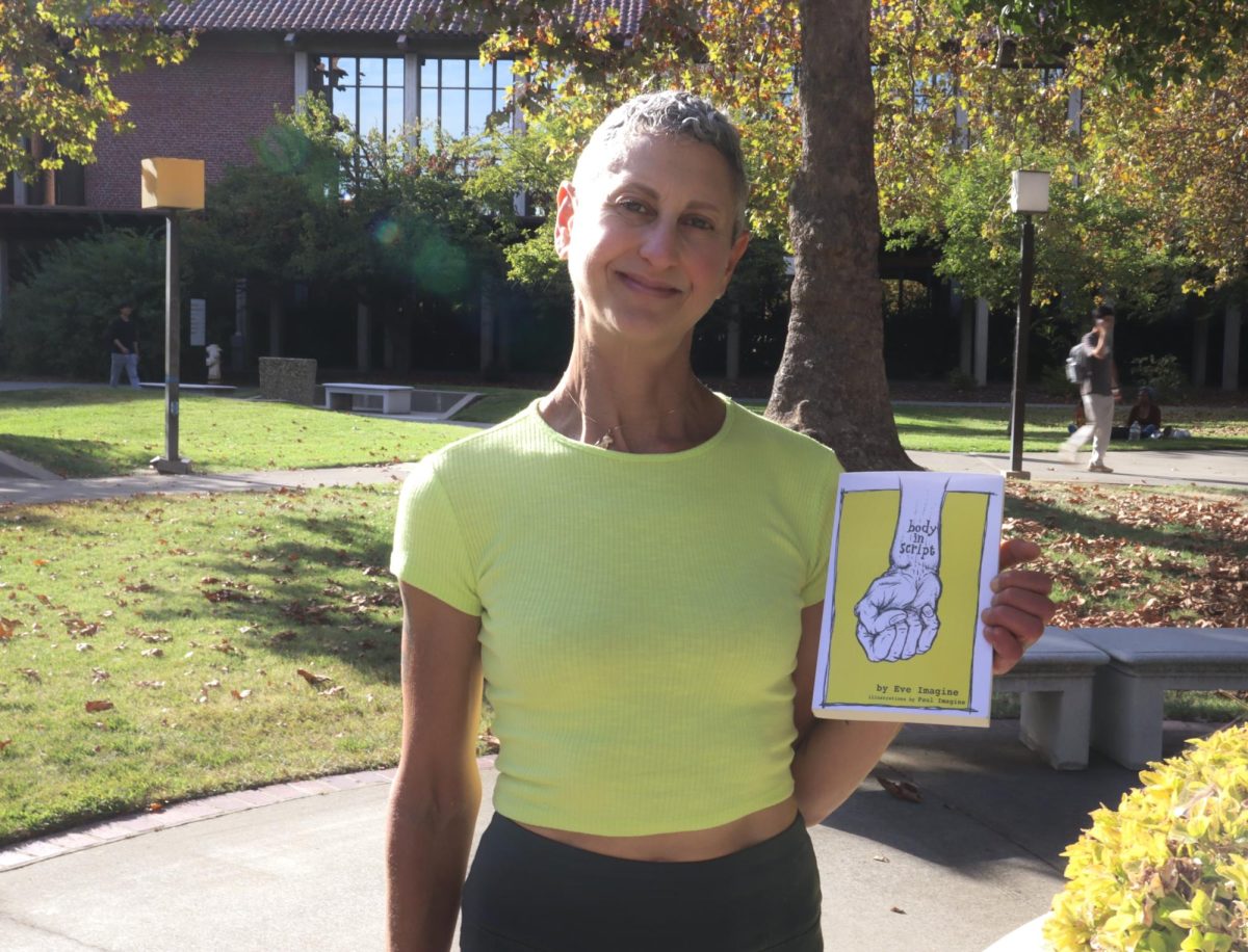 Sacramento City College professor and author of “Body in Script,” Eve Imagine stands in City College’s quad, Thursday, Oct. 10, 2024, in Sacramento, Calif.