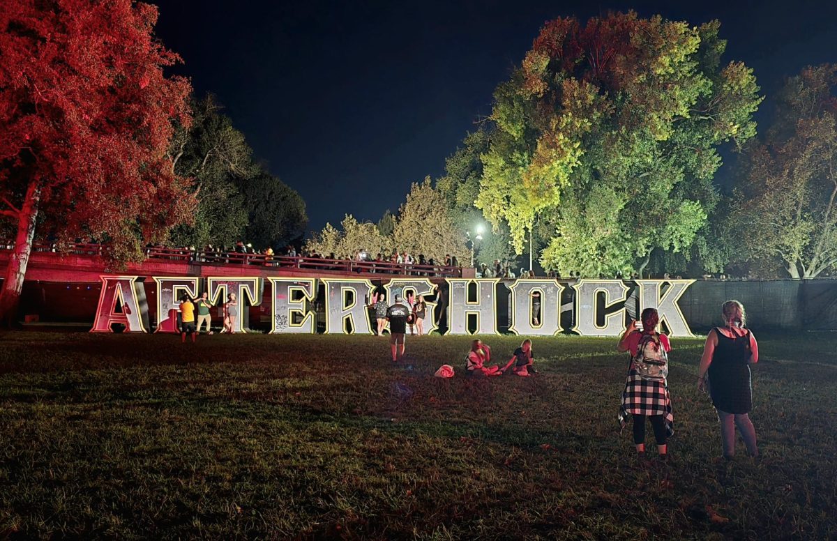 Participants take final photos in front of the Aftershock sign during the last day of the Aftershock music festival at Discovery Park on Sunday, Oct. 13, 2024, in Sacramento, Calif.