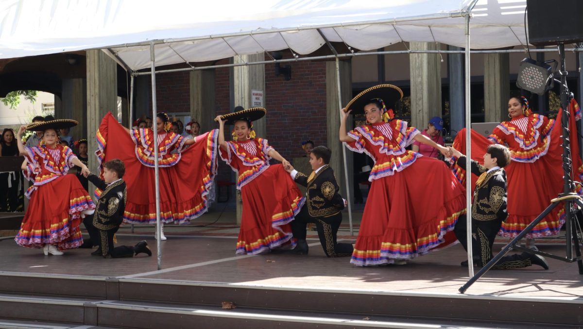 Dancers perform at the Latino Book & Family Festival in front of Sacramento City College’s Cultural Awareness Center on Saturday, Sept. 28, 2024, in Sacramento, Calif. 