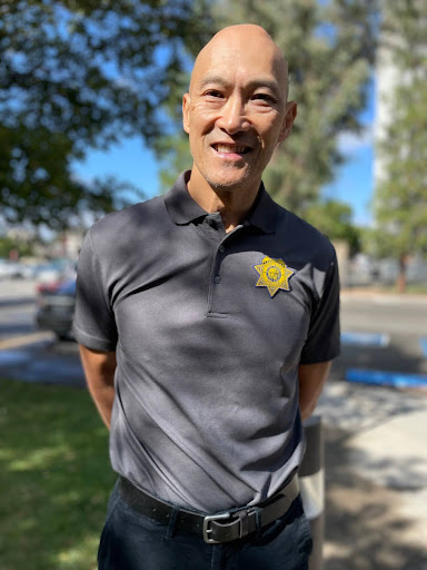 Los Rios Police Chief Harvey Woo stands in front of the Sacramento City College Police Department office Monday, Sept. 17, 2024. Woo started the position on July 10, 2024.