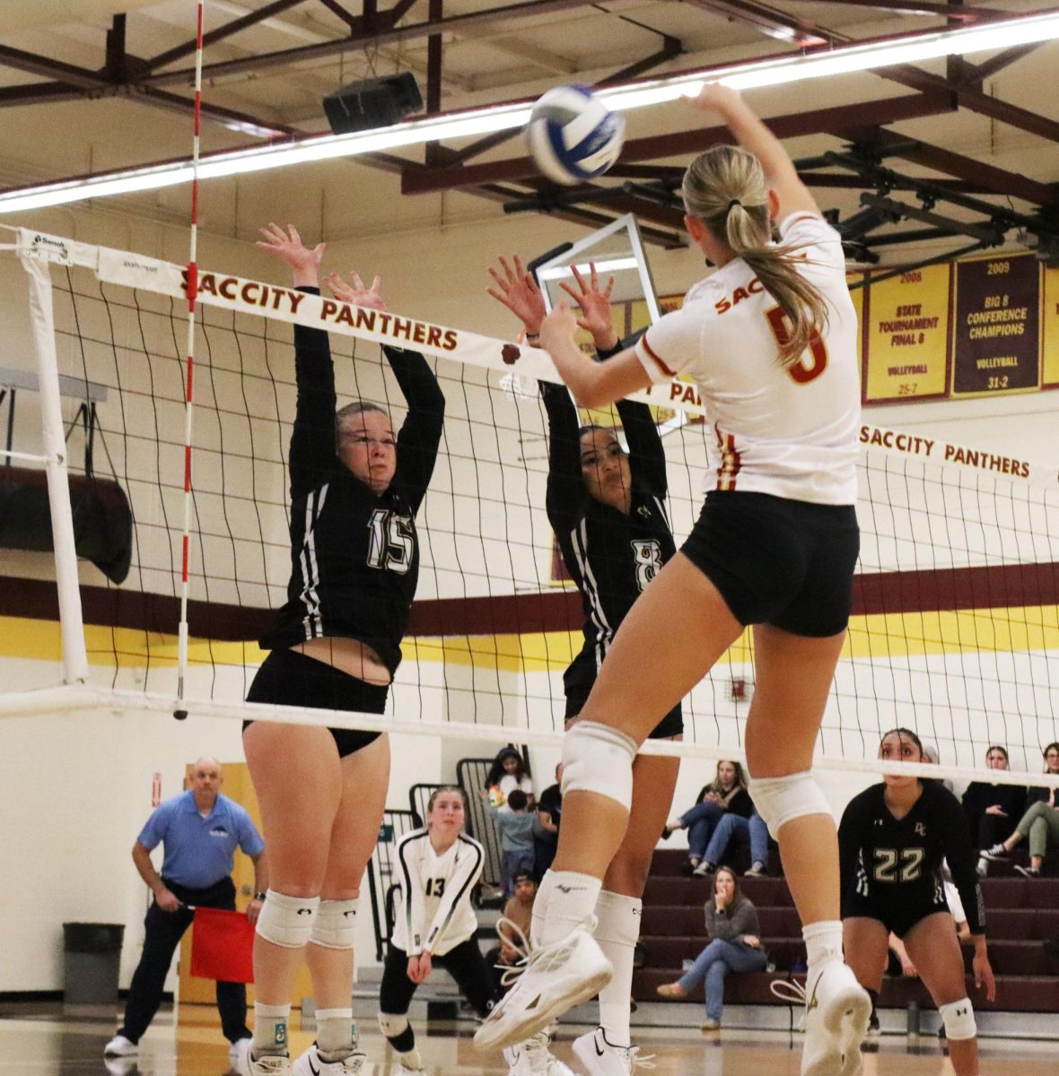 Avery Peterson (#5) Sacramento City College delivers a spike over two San Joaquin Delta players during City College’s match on Wednesday, Nov. 6, in Sacramento, Calif.