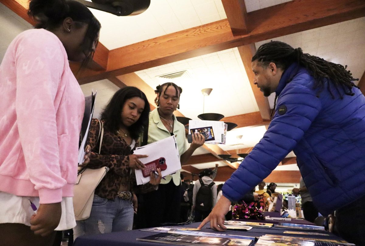 Sacramento City College students speak with Brandon Herring of Coppin State University, Maryland, during the City College HBCU Caravan event on Thursday, Nov. 7, 2024, in Sacramento, Calif.