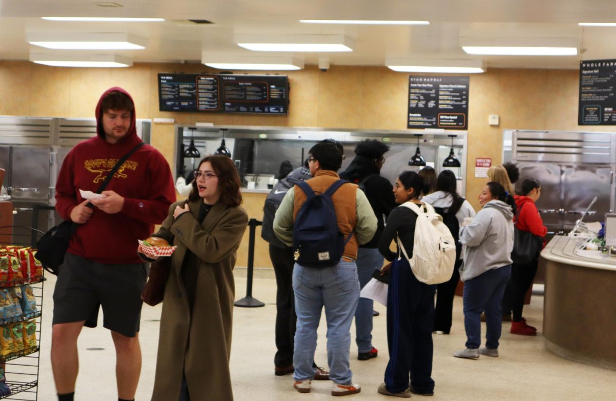 Students wait in line to order and pay for food at Sacramento City College’s City Café on opening day, Tuesday, Nov. 12, 2024 in Sacramento, Calif.