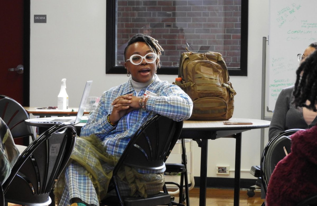 Sacramento City College professor Chipo Ashe speaks to students and attendees at the ASHÉ Center’s "Village Time: Giving Black Women Their Flowers" event on Friday, Feb. 12, 2025, in Sacramento, Calif. 