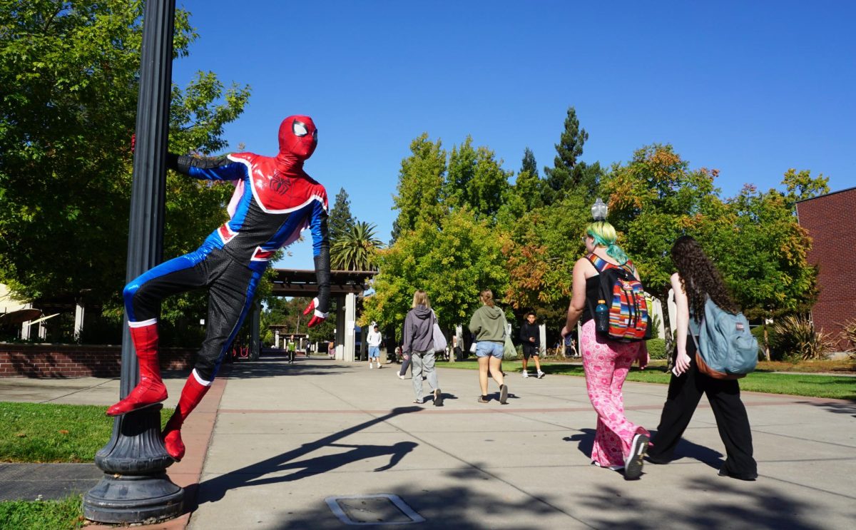 Sacramento City College student and film major Chris Mijares cosplays the role of Spider-Man to protect campus grounds on Sept. 30, 2024, at Sacramento City College in Sacramento, Calif.