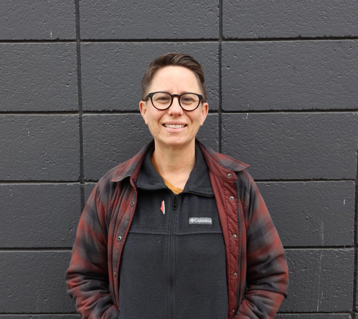 American River College professor Sara Smith-Silverman stands in the alleyway next to Old Soul at the Weatherstone, Monday, Feb. 3, 2025, in Sacramento, Calif.