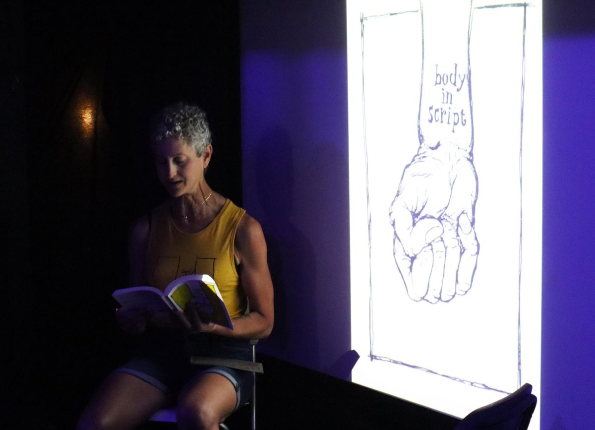 Eve Imagine, Sacramento City College professor and author of “Body in Script,” reads a chapter from her book at The Dreamland Cinema, Saturday, April 12, 2025, in Sacramento, Calif. 