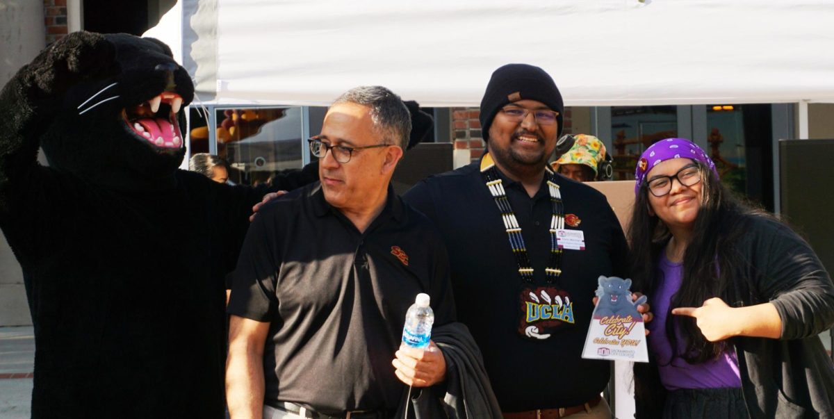 Sacramento City College President Albert Garcia poses for a picture with Hughie, the City College mascot and students accepting an award on Thursday, April 17, 2025 in Sacramento, Calif. 