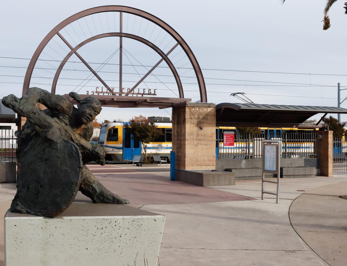 A Sacramento Regional Transit train arrives at the City College Station, near Hughes Stadium and the campus parking garage, on Wednesday, Dec. 3, 2025, in Sacramento, Calif. 