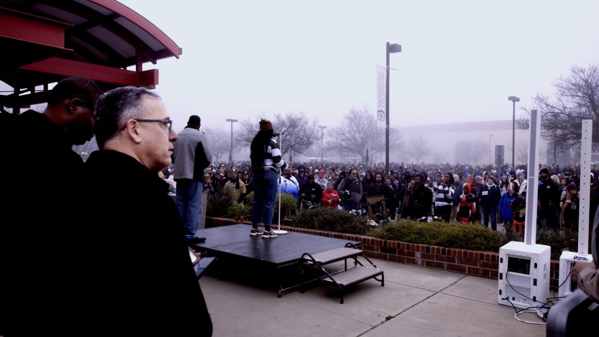 Thousands of marchers gather at Sacramento City College on Monday Jan. 19, 2026. In Sacramento Calif. to begin the annual Martin Luther King Jr. Day march. Joining the marcher on the stage is Sacramento City College President  Albert Garcia who welcomed the attendees to the campus.  (Bob Fredenburg/ Sac City College Express)