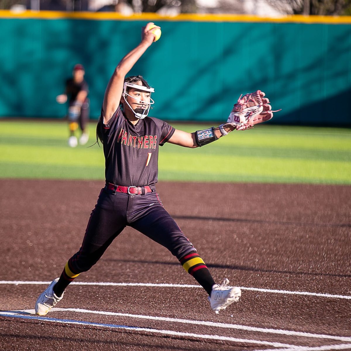 Sacramento City College freshman pitcher Jia Beebe (1) delivers a sixth inning pitch during the Panthers’ second home game of a double header against Hartnell College on Saturday, Jan. 24, 2026, in Sacramento, Calif. Beebe pitched the full seven innings and scored a run in the Panthers’ 2-1 victory over the Jaguars, splitting the double header.