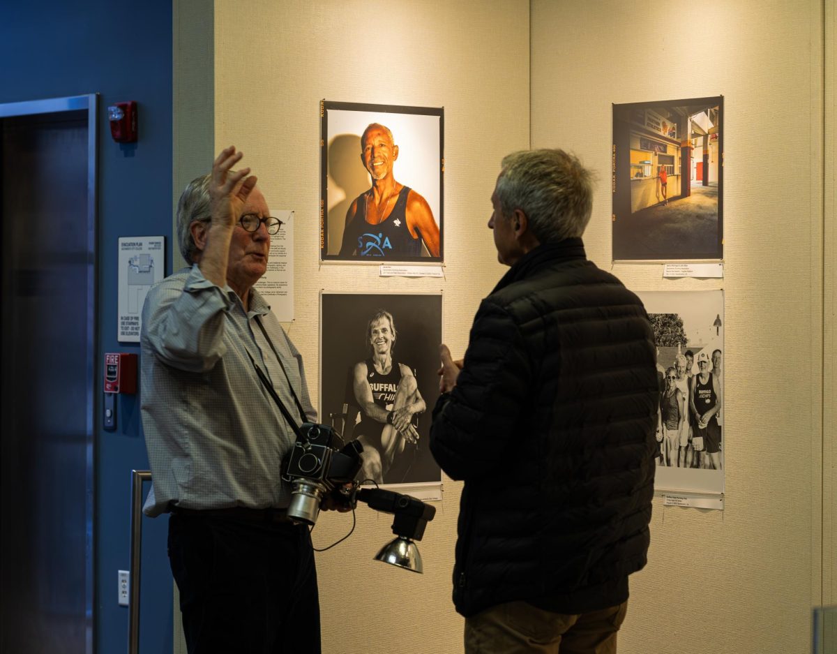 Exhibiting photographer Bob Fredenburg speaks to a visitor at the Russ Solomon Gallery on Tuesday, Jan. 27, 2026, in Sacramento, Calif.