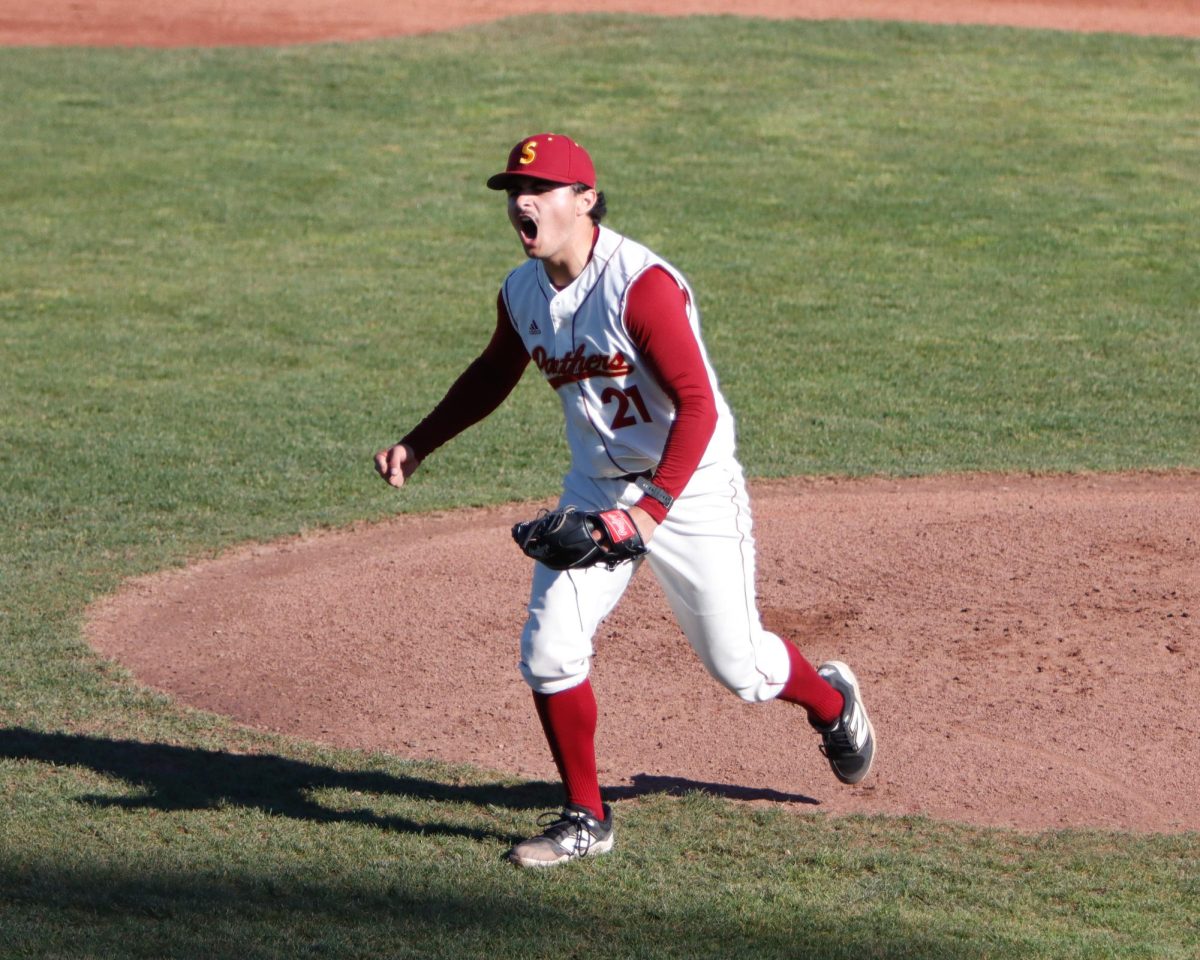 Sacramento City College’s starting pitcher Russ Pettis (21) hops off the mound screaming for his team after leaving runners in scoring position and back-to-back strikeouts to end the top of the third inning with no runs scored for Reedley College on Thursday, Feb. 12, 2026 in Sacramento, Calif.